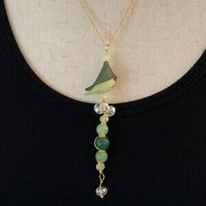 Lady with hat‎ necklace.Lucite flowers and crystals